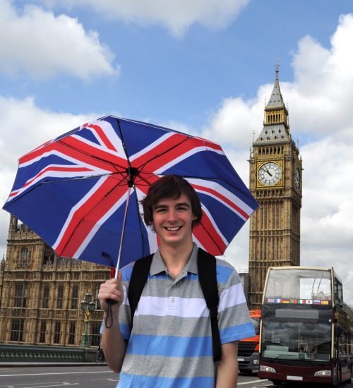 Big Ben and tourist with British flag umbrella in London